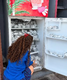 Instagram post: stocking a community fridge