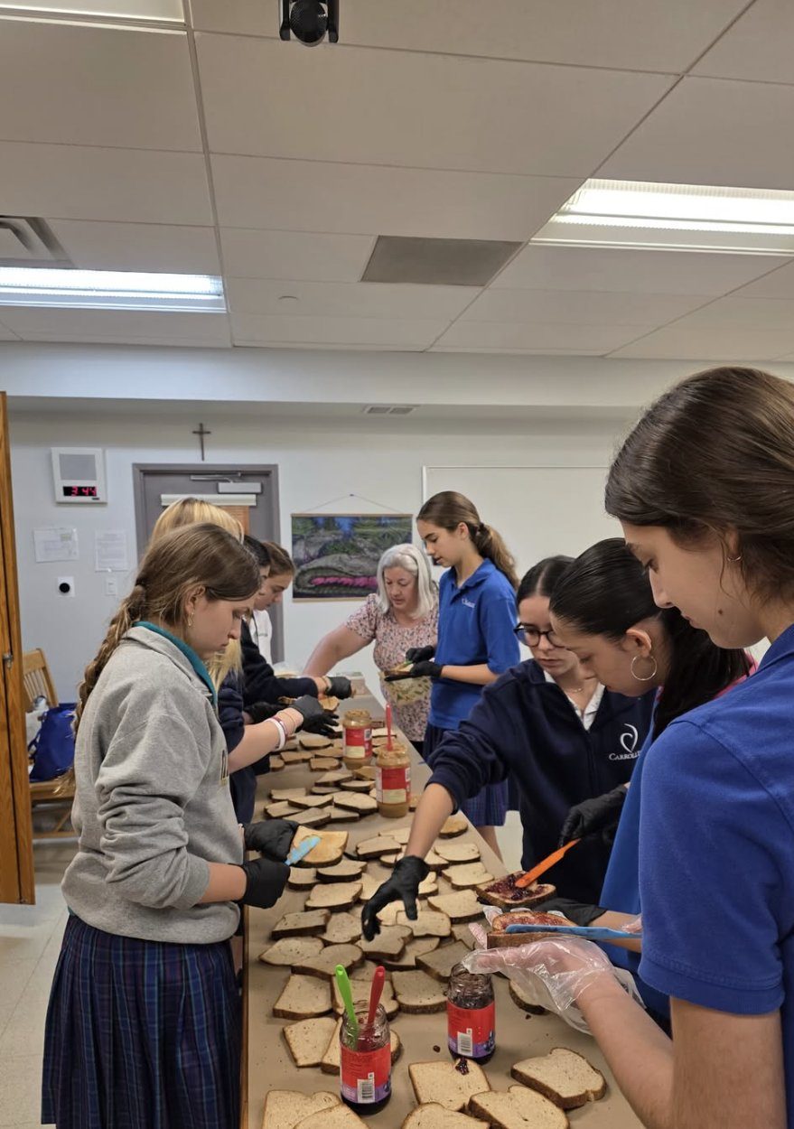 An assembly line of students making sandwiches