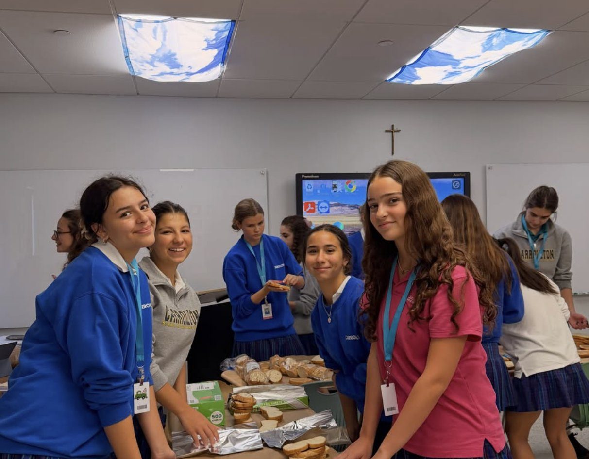 Students wrapping sandwiches in foil